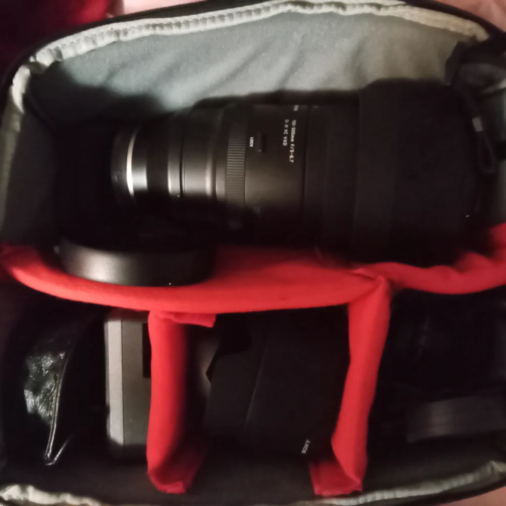 Black Telephoto Zoom Lens with Textured Focusing Ring and Robust Construction